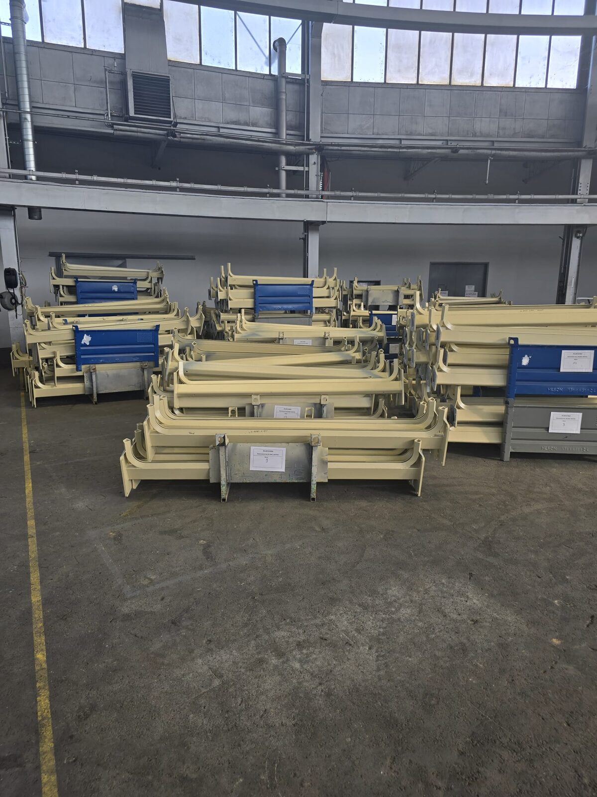 Fabricated screen parts staged on the factory floor